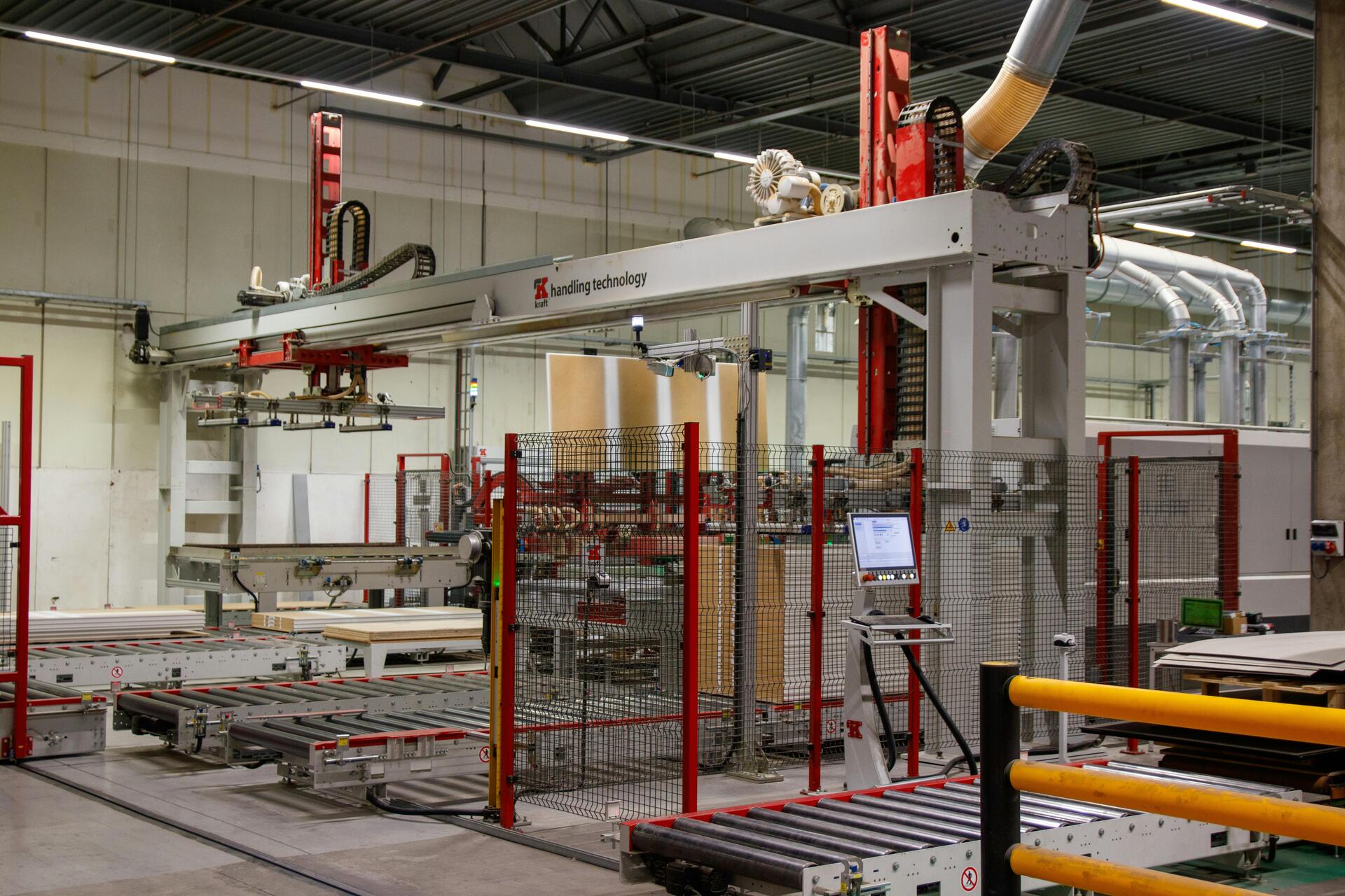 Factory interior with material handling gantry